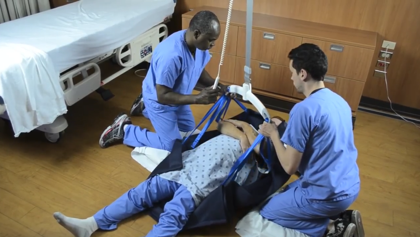 MedCo Technology Full Body Repositioning Sling used to recover a patient from the floor with a lift